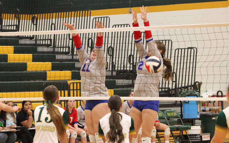 (ALEX HAVARDANKSY | THE GRAHAM LEADER) Landree Smith (left) and Collins Weil (right) go up for a block Tuesday, Aug. 26, against the Lady Jackets. Smith and Weil were putting in work at the front of the net defensively to keep the Lady Blues competing.