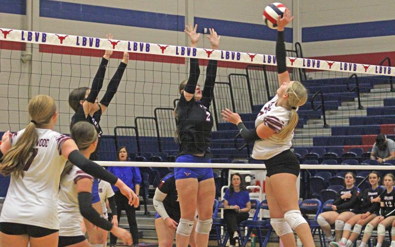 (ALEX HAVARDANSKY | THE GRAHAM LEADER) Collins Weil, 2, goes up for a block for the Lady Blues in their match Tuesday, Sept. 23, against the Brownwood Lady Lions. The Lady Blues defeated the Lady Lions in three sets.