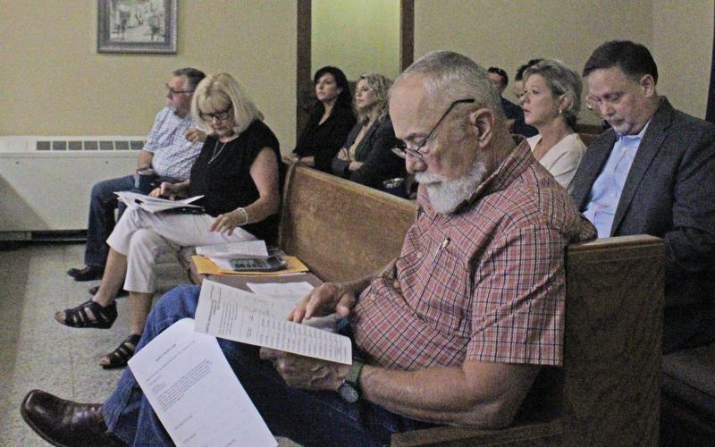(ALEX HAVARDANSKY | THE GRAHAM LEADER) A crowd listens in on notable Young County budget items Monday, Aug. 25. Despite a large crowd, there were no public comments on the finalized budget. 