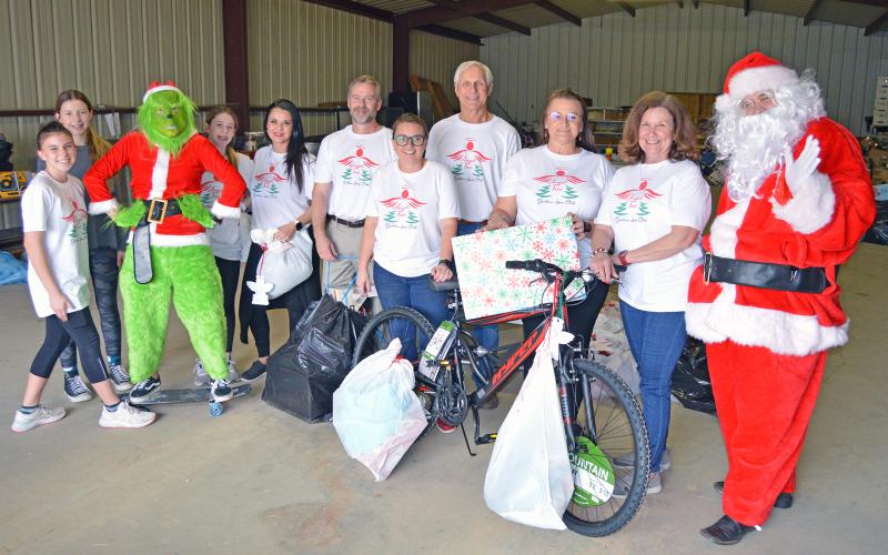 (ARCHIVE PHOTO | THE GRAHAM LEADER) Members of Graham Lions Club distribute gifts to members of the community for the Angel Tree project. The distribution day for the Lions Club program will be Friday, Dec. 19. 