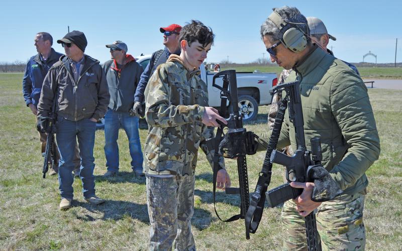 (ARCHIVE PHOTO | THE GRAHAM LEADER) Hunters review safety procedures required before hunting in the Helicopter Hog Hunt in March 2023. This year, the hog hunt will be held from March 19-22 at the Young County Warrior Ranch.