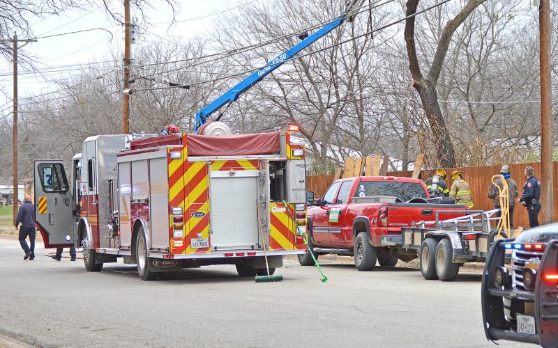 (THOMAS WALLNER | THE GRAHAM LEADER) Graham Police Department is investigating an electrical accident resulting in the death of two tree trimmers late Friday morning.