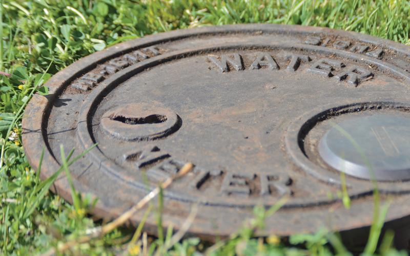 (ARCHIVE PHOTO | THE GRAHAM LEADER) A water meter lies buried in Graham on Second Street. The city is looking to complete a lead service line inventory in order to comply with a directive from the Texas Commission on Environmental Quality and the U.S. Environmental Protection Agency.