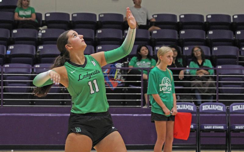 (ALEX HAVARDANKSY | THE GRAHAM LEADER) Emma Hawkins attempts a serve Saturday, Aug. 16. Hawkins is one of the veteran leaders of this Ladycats team.