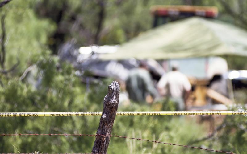 (ARCHIVE PHOTO | THE GRAHAM LEADER) Crime-scene tape lines a fence along FM 209, about 10 miles west of Graham where unidentified human remains were found, which were later determined to be those of Leah Martin. The Oxygen Network true-crime television show ‘Buried in the Backyard’ will be filming an episode focused on the murder of Martin next week in Graham.
