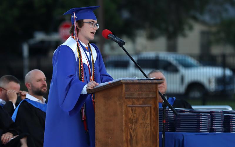 (THOMAS WALLNER | THE GRAHAM LEADER) Salutatorian Ryder Calhoun speaks to the Class of 2026 graduating class during the graduation ceremony held Friday, May 22 at Newton Field. 