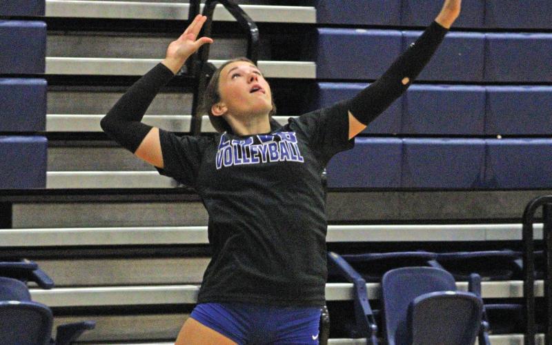(ALEX HAVARDANSKY | THE GRAHAM LEADER) Hadleigh Allen takes a swing at a serve Saturday, Aug. 9. Allen was very effective at the service line picking up multiple aces against Iowa Park and Legacy.