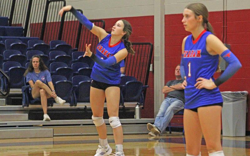 (ALEX HAVARDANKSY | THE GRAHAM LEADER) Hadleigh Allen swings at a ball for a serve Friday, Sept. 12. Allen is one of the team's primary setters but aided the team in set two at the service line.