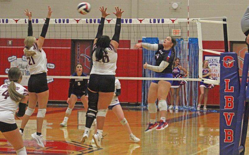 (ALEX HAVARDANSKY | THE GRAHAM LEADER) Hudson Wright swats the ball over the net for a kill Tuesday, Sept. 23. Wright picked up multiple key points in the Lady Blues victory over the Brownwood Lady Lions.