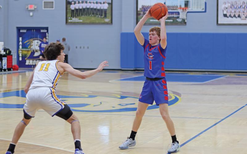 (THOMAS WALLNER | THE GRAHAM LEADER) Tyler Allen searches for an open Steers teammate during the matchup against Brock last Saturday, Jan. 11. The Steers fought hard but the game ultimately ended in a 89-28 loss. 