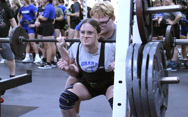 (TC GORDON | THE GRAHAM LEADER) Graham’s Jayden Frost completes her squat lift during a powerlifting meet held in Graham Thursday, Feb. 1.