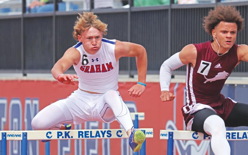 (THOMAS WALLNER | THE GRAHAM LEADER) Andon Masterfield runs the 110 Meter Hurdles during the 77th annual PK Relays held Saturday, March 15 where he picked up a first place finish with a time of 15.14. Despite winds blowing through Friday, March 14, cloudy and sunny weather filled the day for the event.