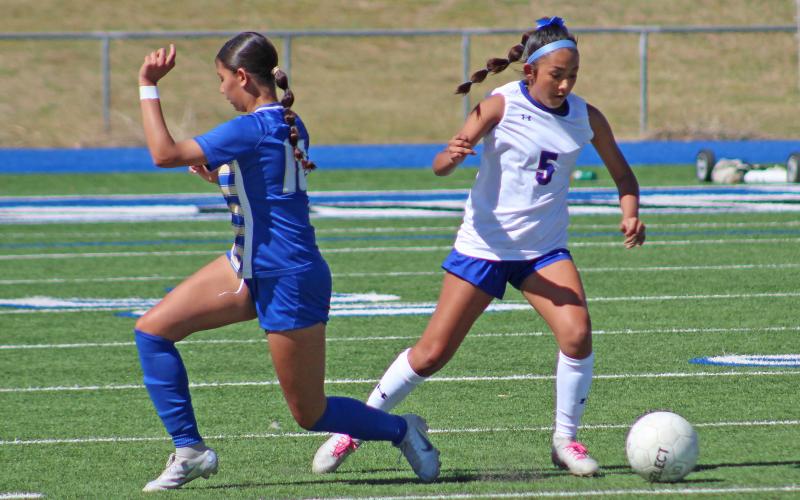 (TC GORDON | THE GRAHAM LEADER) Graham’s Mai Bara crosses over an opposing player with a move inside as she brings the ball up the field during the team’s area round playoff game. The Lady Blues fought hard but lost 2-1 to San Elizario and saw their season come to an end.