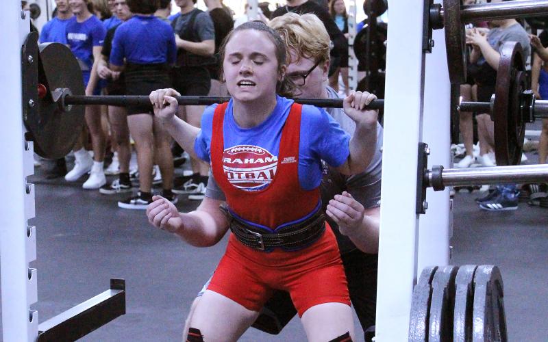(TC GORDON | THE GRAHAM LEADER) Graham’s Mariah Frost finishes one of her squat lifts during a powerlifting competition held in the GHS field house Thursday, Feb. 1.