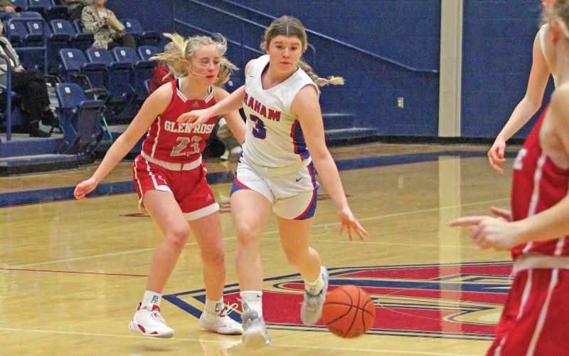 (TC GORDON | THE GRAHAM LEADER) Graham sophomore Mayci Ryans dribbles the ball up the court through multiple Glen Rose defenders during a district matchup between the teams last Friday, Feb. 2. The Lady Blues took a 54-19 loss to the Lady Tigers.