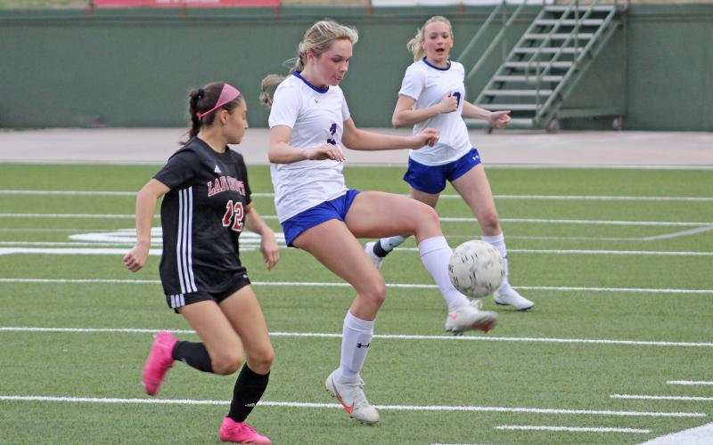 (TC GORDON | THE GRAHAM LEADER) Graham junior Camden Thorne touches the ball to gain control after receiving a pass from a teammate during the team’s district game Tuesday, Feb. 27 against Wichita Falls Old High. The Lady Blues took a tough 6-1 loss.