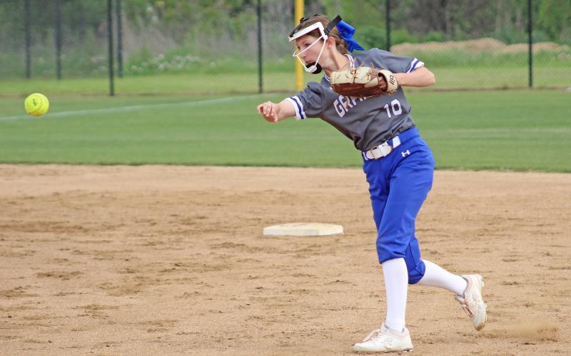 (TC GORDON | THE GRAHAM LEADER) Second baseman Tiffany Cotter fields the ball and makes an easy throw to first base for an out during Graham’s 13-7 win over Mineral Wells last Friday, April 19. The Lady Blues clinched the district championship with the win.
