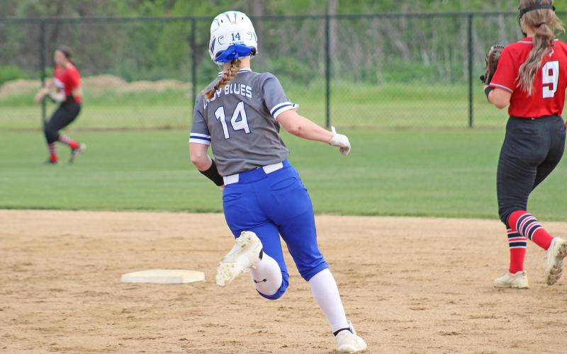(TC GORDON | THE GRAHAM LEADER) Graham’s Larissa Warren runs towards second base after one of her teammates got a hit during the team’s final regular season game against Mineral Wells. The Lady Blues won 13-7 and claimed a district championship.