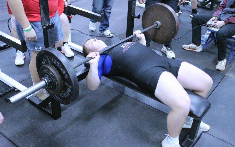 (TC GORDON | THE GRAHAM LEADER) Graham’s Scout Smith completes one of his bench press reps during one of the team’s powerlifting meets earlier this season. Smith was one of five Steers to qualify for the regional meet this Saturday, March 2, in Decatur.