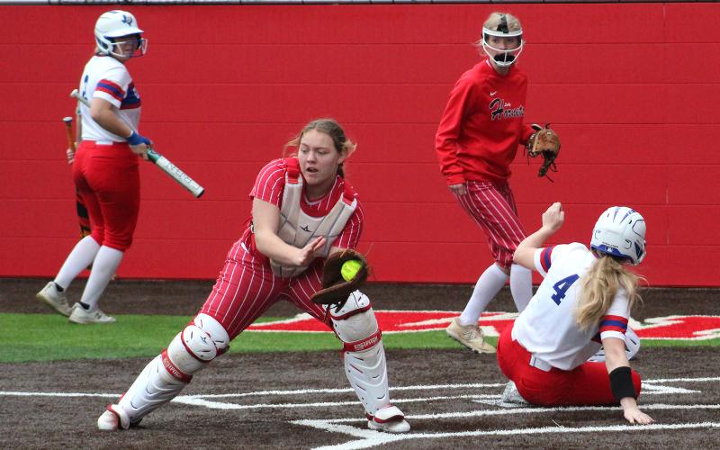 (TC GORDON | THE GRAHAM LEADER) Graham’s Mayci Ryans (4) slides into home plate ahead of the throw home to score a run during one of her team’s games over the weekend in a tournament they hosted. The Lady Blues played four games over three days and went 4-0.