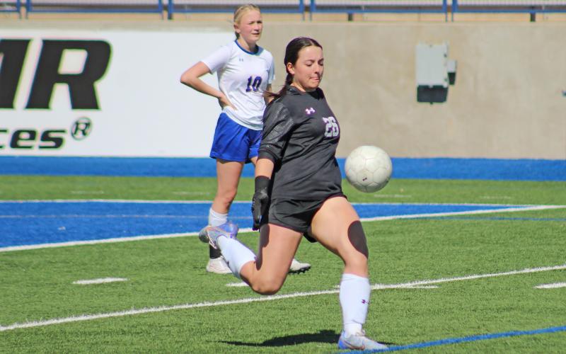 (TC GORDON | THE GRAHAM LEADER) Graham goalkeeper Taylor Lauster kicks the ball deep after making a save during the team’s matchup with San Elizario in the area round of the playoffs. The Lady Blues took a 2-1 loss to one of the top ranked teams in the Lady Eagles.