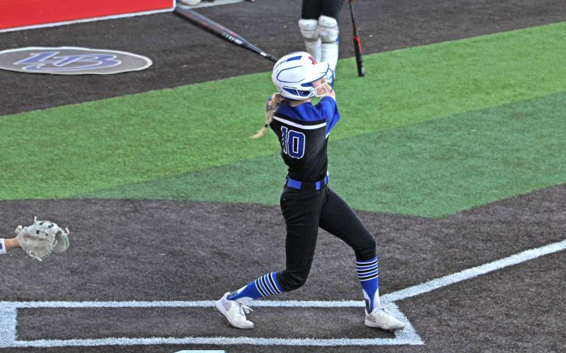 (ALEX HAVARDANSKY | THE GRAHAM LEADER) Tiffany Cotter takes a swing at a pitch for the Lady Blues in their matchup Tuesday, April 15 against the Lady Lions. Cotter has served as the Lady Blues starting shortstop this season.