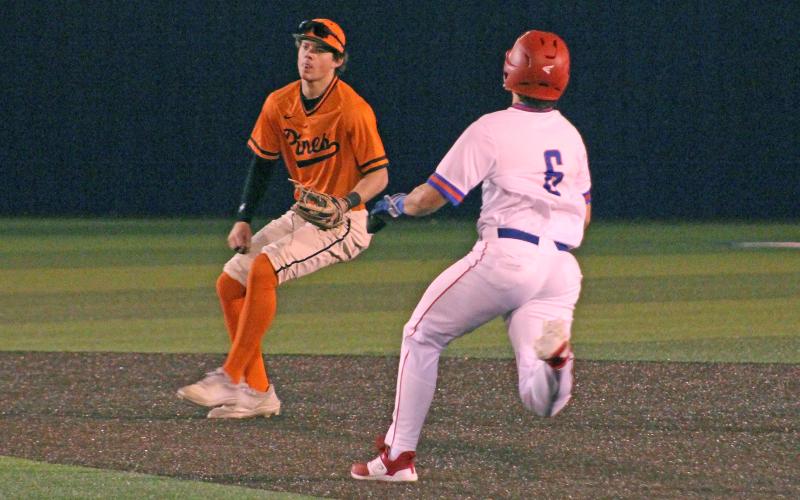 (TC GORDON | THE GRAHAM LEADER) Sophomore Tripp Mahaney steals second base late in the game during Graham’s season-opener Monday, Feb. 19 against Springtown. The Steers dealt with a number of errors and took a 6-2 loss to the Porcupines.