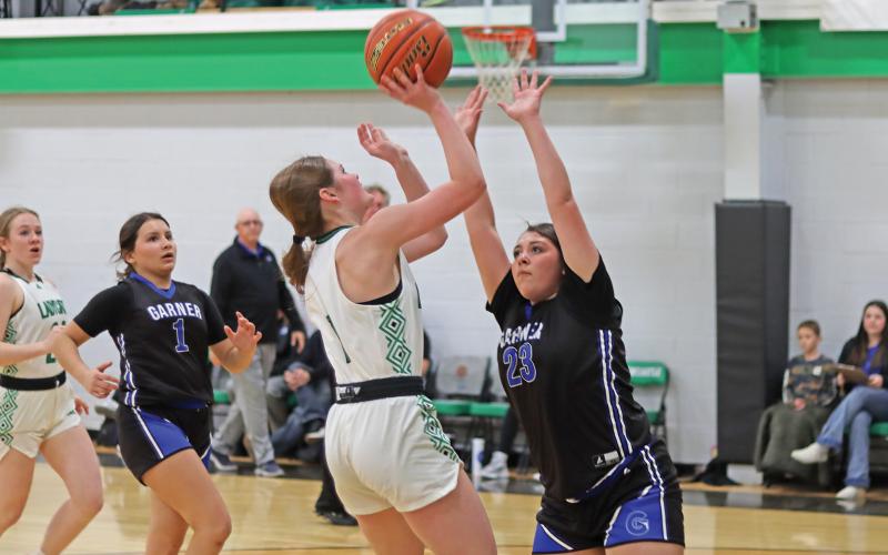 (ARCHIVE PHOTO | THE GRAHAM LEADER) Newcastle’s Camren Mallory attempts a shot over a Garner defender in a game last season. The Newcastle Ladycats fell to the Graford Lady Rabbits in their matchup Tuesday, Nov. 11.