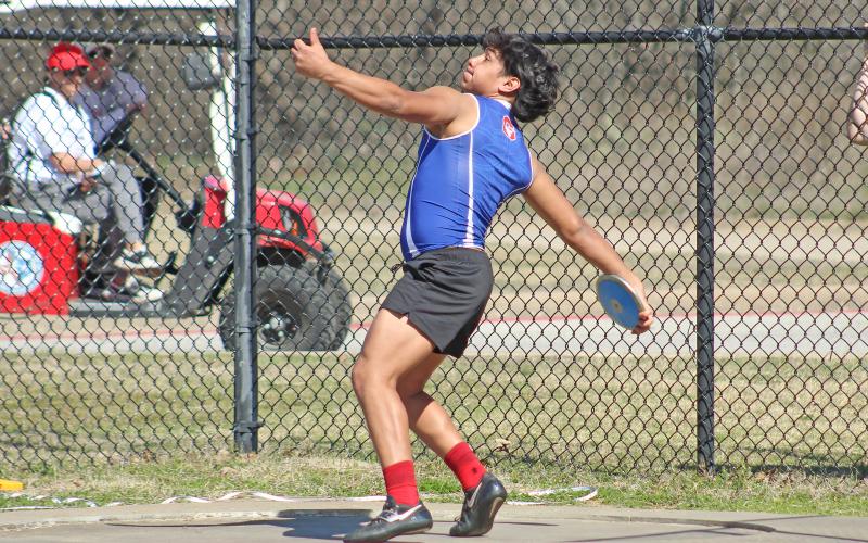 (TC GORDON | THE GRAHAM LEADER) Mateo Rodriguez spins to build momentum before releasing his discus throw during the Mineral Wells Ram Relays last Saturday, Feb. 24. The meet was the first track and field event of the season for Graham.