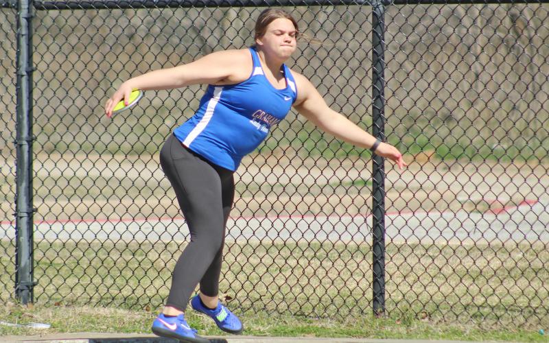 (TC GORDON | THE GRAHAM LEADER) Graham’s Hallie Gough begins her motion in the discus throw competition at the Mineral Wells Ram Relays last Saturday, Feb. 24.