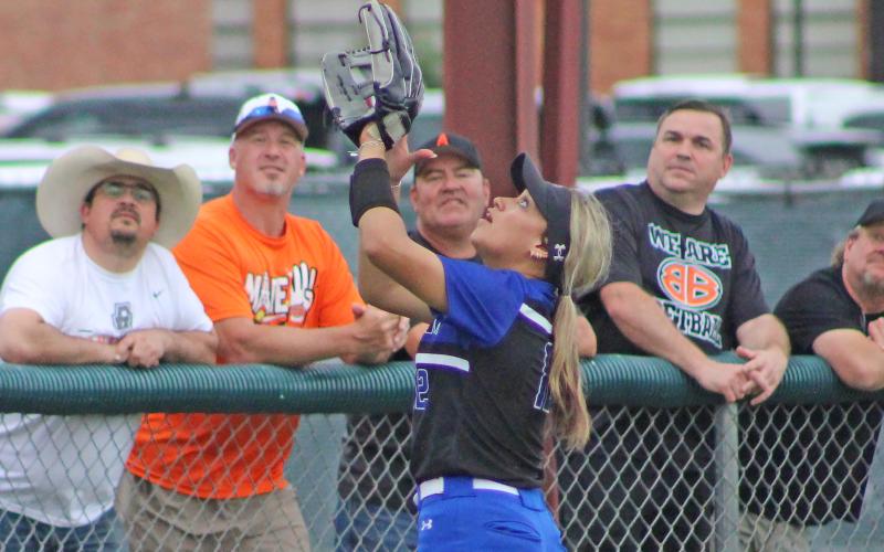 (TC GORDON | THE GRAHAM LEADER) Senior shortstop Olga Morales tracks a fly ball into foul territory in front of opposing fans during the second game of the best-of-three series against Burkburnett in the area playoffs. The Lady Blues fought hard in both contests but took losses in each game which ended their season.