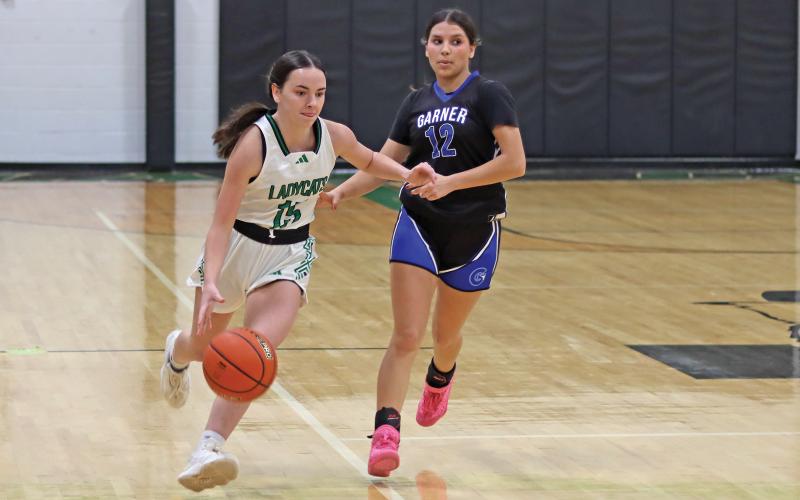 (THOMAS WALLNER | THE GRAHAM LEADER) Rae’Lynn Bennett crosses the court to look for an open Ladycats’ teammate during their Tuesday, Jan. 14 game against Garner. The team will travel Tuesday, Jan. 21 for a 6 p.m. matchup against Throckmorton.