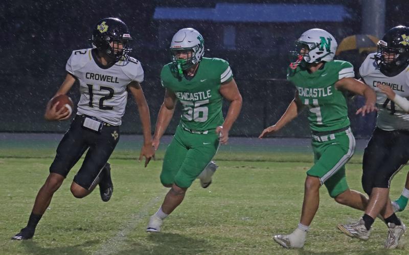 (THOMAS WALLNER | THE GRAHAM LEADER) Cooper Clayton (56) and Rylan Hinojosa (4) run after the quarterback to try and pick up a sack Friday, Sept. 5. Head coach Isiah Archer said the defense was dominant throughout the Bobcats 73-0 victory over Crowell. 