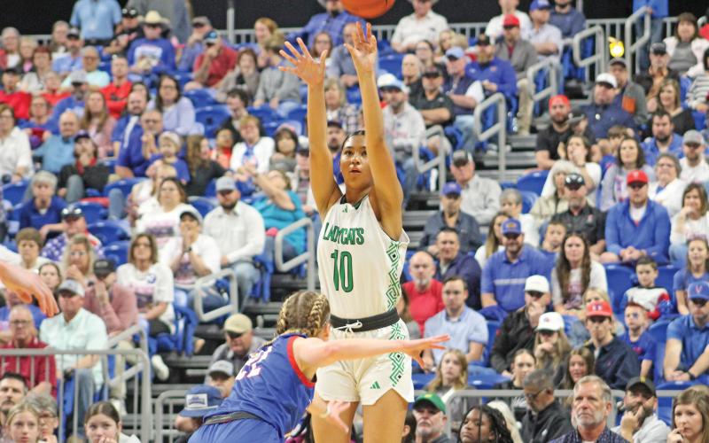 (ARCHIVE PHOTO | THE GRAHAM LEADER) Senior Mya Cabrera shoots a 3-pointer from the corner over a Turkey Valley defender during Newcastle’s state final win over the Lady Patriots 48-32. The Ladycats dominated the state tournament and were crowned 1A champions.