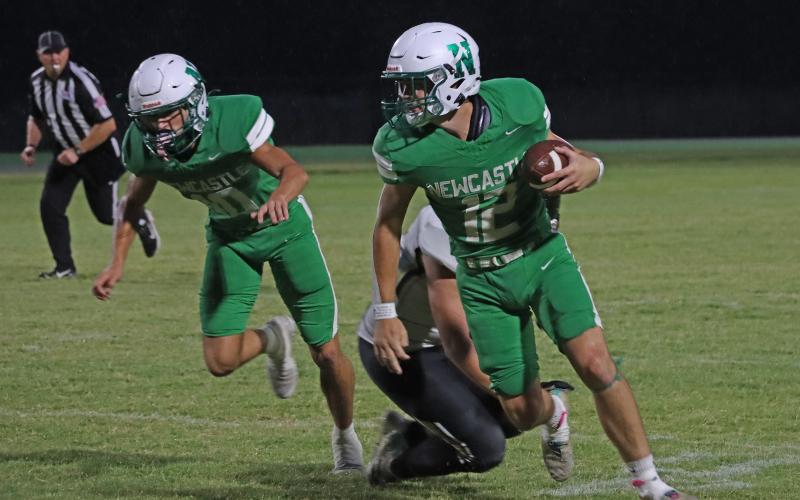(THOMAS WALLNER | THE GRAHAM LEADER) Mikey Soito runs away from defenders with the football Friday, Sept. 5, against the Crowell Wildcats. Soito is one of the veteran leaders on this team as a senior.