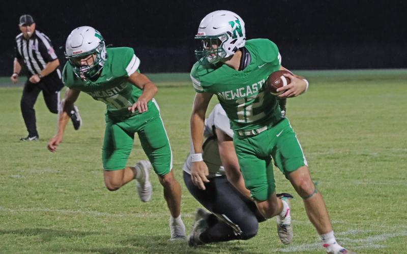 (ALEX HAVARDANSKY | THE GRAHAM LEADER) Mikey Soito runs away from defenders Friday, Sept. 5, against Crowell. Soito contributed on both sides of the ball to help the Bobcats pick up a massive 73-0 win. 