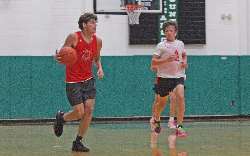 (ALEX HAVARDANSKY | THE GRAHAM LEADER) Brodie Martin takes the ball up the floor Tuesday, June 17, against the Albany Lions. Martin was a consistent scorer in both games.