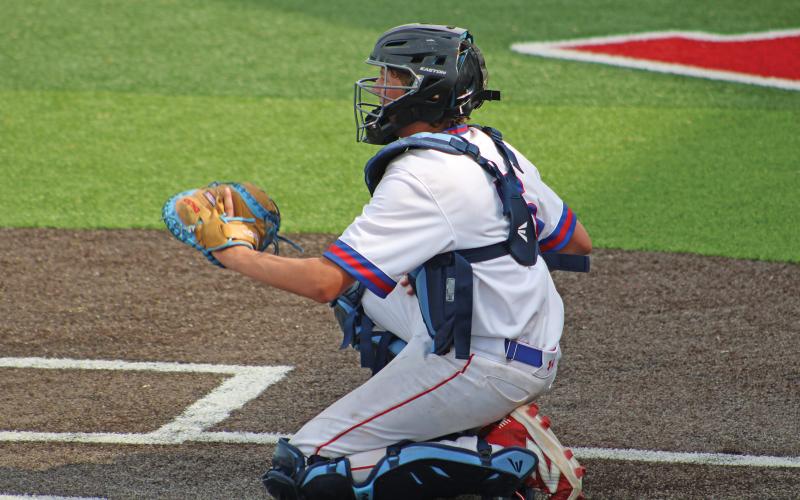 (ALEX HAVARDANSKY | THE GRAHAM LEADER) Colton Doyle behind the dish for the Steers in their matchup Thursday, April 17 against the Stephenville Yellow Jackets. Doyle split time in this game at both catcher and pitcher for the team. 