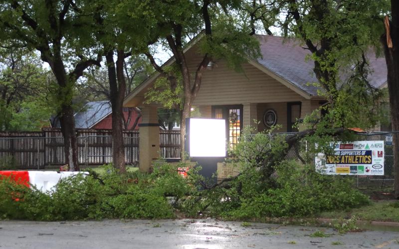 (THOMAS WALLNER | THE GRAHAM LEADER) A tree limb that fell near Open Door Christian School in Graham. Staff of ODCS and members of Oak Street Baptist Church helped to clean up debris in the area.
