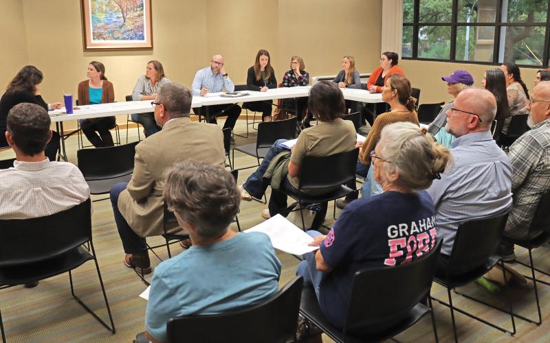 (THOMAS WALLNER | THE GRAHAM LEADER) Members of the public sit in attendance at the Library of Graham board meeting held Wednesday, Oct. 25. Members of the public in attendance raised concerns for the content and location of a book within the library.