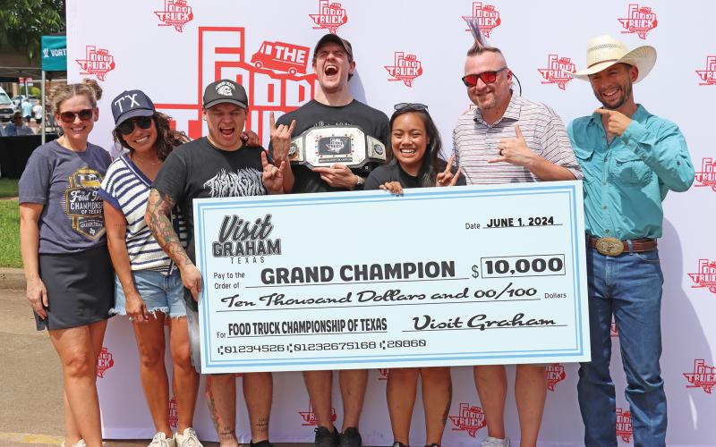 (ARCHIVE PHOTO | THE GRAHAM LEADER) The Food Truck Championship of Texas grand champion winning truck Insurgent poses with their $10,000 check at the 2024 event on the Graham downtown square. The event this year will kick off at 11 a.m. Saturday, June 7. 