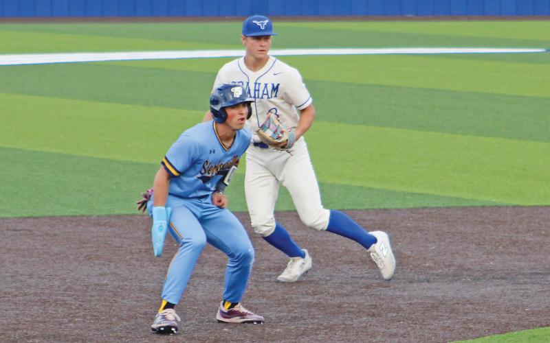 (ALEX HAVARDANSKY | THE GRAHAM LEADER) Harison Brockway attempts a pickoff at second base for the Steers in their matchup Thursday, April 17 against the Stephenville Yellow Jackets. Brockway has been the everyday starter at shortstop for the Steers.
