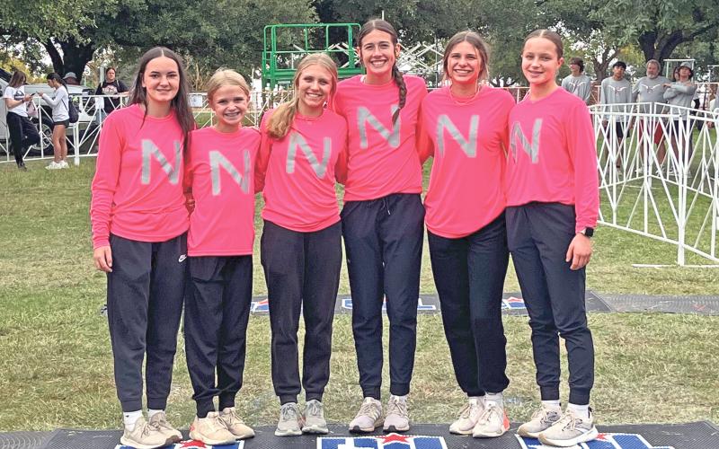 (ARCHIVE PHOTO | THE GRAHAM LEADER) The Newcastle Ladycats cross country team the day before their race in the state meet which was held Saturday, Nov. 2. The Ladycats came in 11th place as a team, led by senior Mattie Dollar who finished 33rd overall.