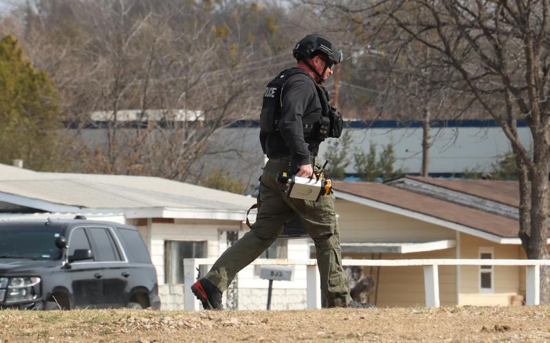 (THOMAS WALLNER | THE GRAHAM LEADER) A member of the Denton Fire Department bomb disposal team on scene at the Gateway Inn.