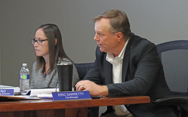 (KYLIE BAILEY | THE GRAHAM LEADER) City Manager Eric Garretty speaks with the Graham City Council during their meeting Thursday, Jan. 16. The city council made the determination to choose a new solid waste provider for the city during the meeting.