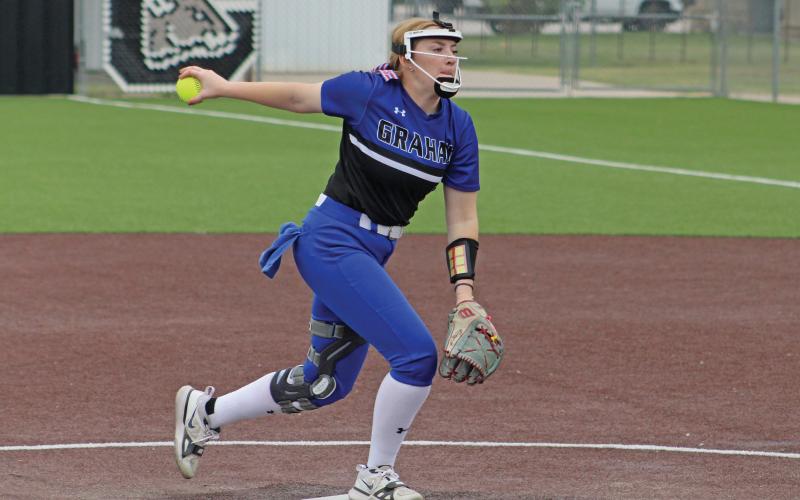 (ALEX HAVARDANSKY | THE GRAHAM LEADER) Zoey Harrell up on the mound for the Lady Blues Friday, April 18. Harrell was voted as a first team All-District Pitcher and will continue her athletic career at Austin College in the fall.