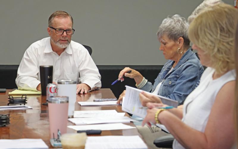 (THOMAS WALLNER | THE GRAHAM LEADER) Graham Economic Improvement Corporation Chair Jack Graham (left) and Executive Director Melinda Brown meet at the regular GEIC meeting held Wednesday, June 25. The organization approved an incentives agreement with Cheldan Homes, LLC for housing development.