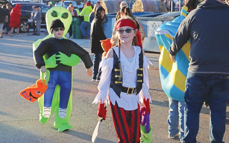 (ARCHIVE PHOTO | THE GRAHAM LEADER) The downtown square lined with trick or treaters during the Graham Chamber of Commerce Truck or Treat event in 2023. One of the more popular neighborhoods in Graham on South Rodgers Drive will have added Halloween safety measures this year.