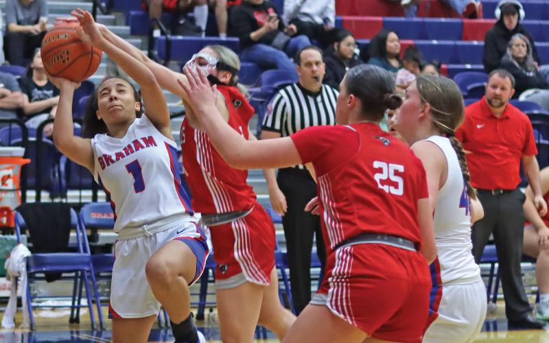 THOMAS WALLNER | THE GRAHAM LEADER Savannah Fricks of the Lady Blues attempts a shot during the game Friday, Jan. 17 against the Mineral Wells Lady Rams.