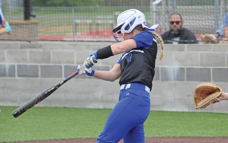 (ALEX HAVARDANSKY | THE GRAHAM LEADER) First baseman Larissa Warren lines a hit into right field for the Lady blues in the top of the seventh Friday, April 18. Warren kicked off the game winning sequence for the Lady Blues against the Lady Rams.